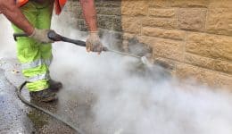 doff-cleaning-a-hamstone-wall