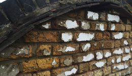 Repairs and repointing required to bricks and tiles above the dutch gable