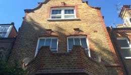 Resurfaced dutch gable blending beautifully with original brickwork