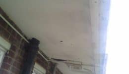 Damage to underside of balcony walkway