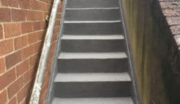 Stairwell coated with Polyac Rapid, rapid cure, anti-slip-waterproofing system.