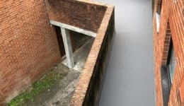 Aerial view of external walkway coated in Polyac Rapid, anti-slip, waterproof, decorative, concrete coating system.