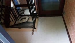 tired and damaged communal walkway